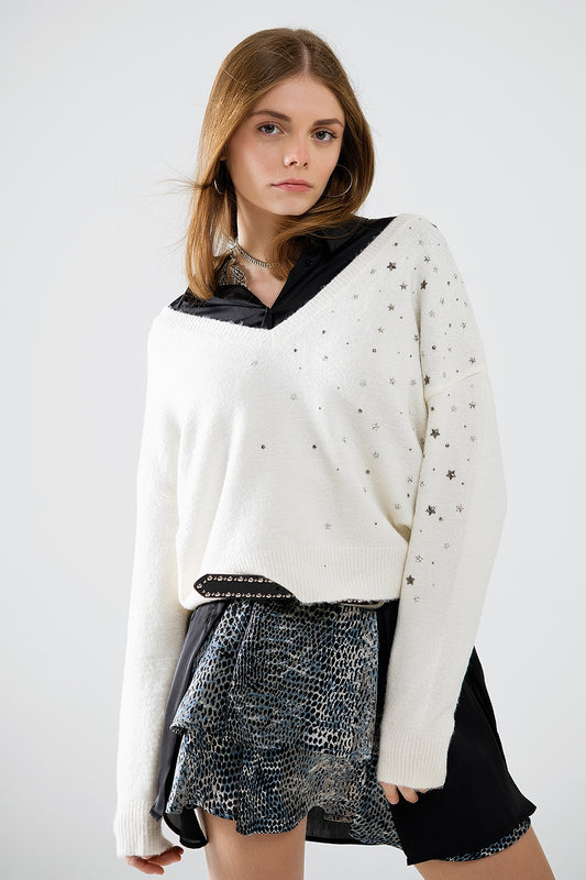 Pull à col en V orné d'étoiles métalliques