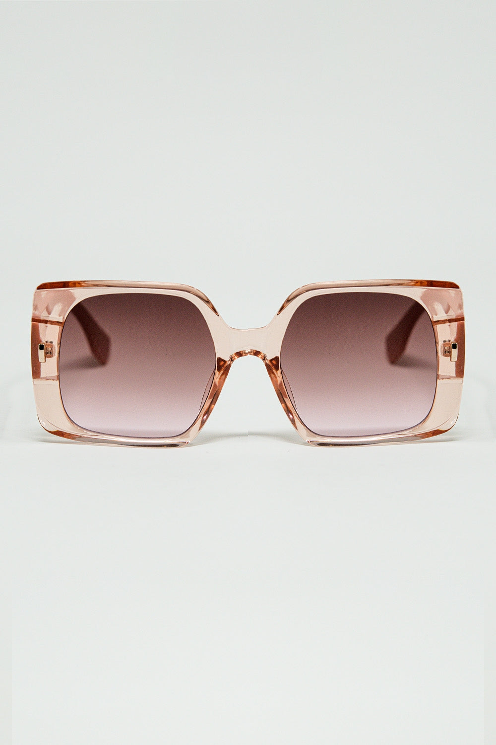 Lunettes de soleil carrées roses avec détails dorés sur le côté