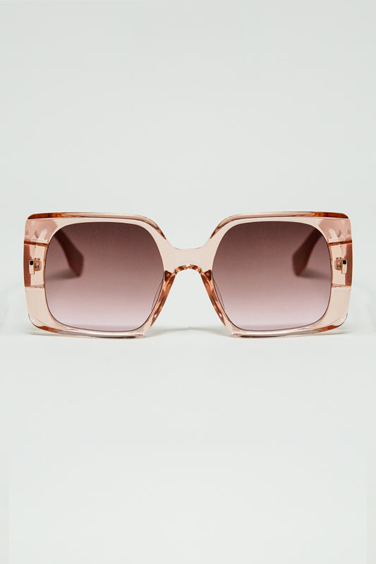 Lunettes de soleil carrées roses avec détails dorés sur le côté