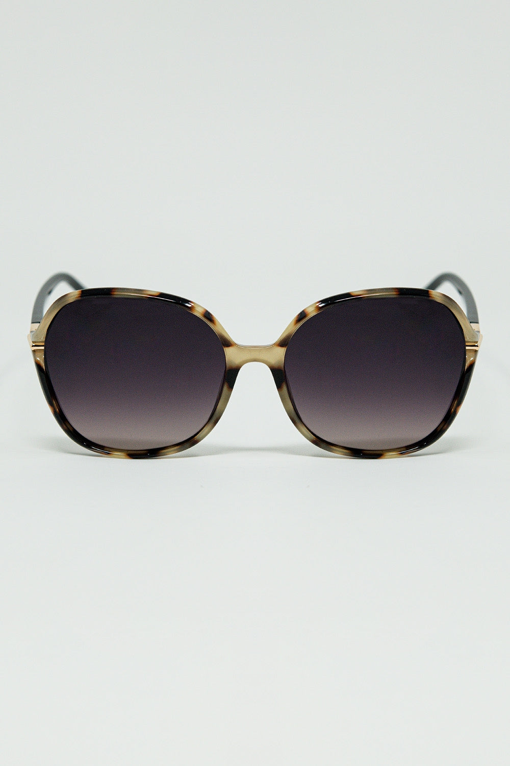 Lunettes de soleil rondes imprimées en beige avec détails en métal doré