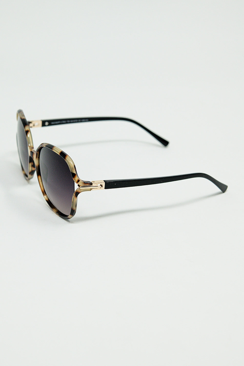 Lunettes de soleil rondes imprimées en beige avec détails en métal doré