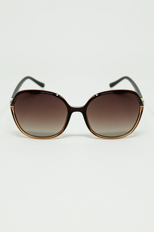 Lunettes de soleil rondes de couleur caramel avec détails en métal doré
