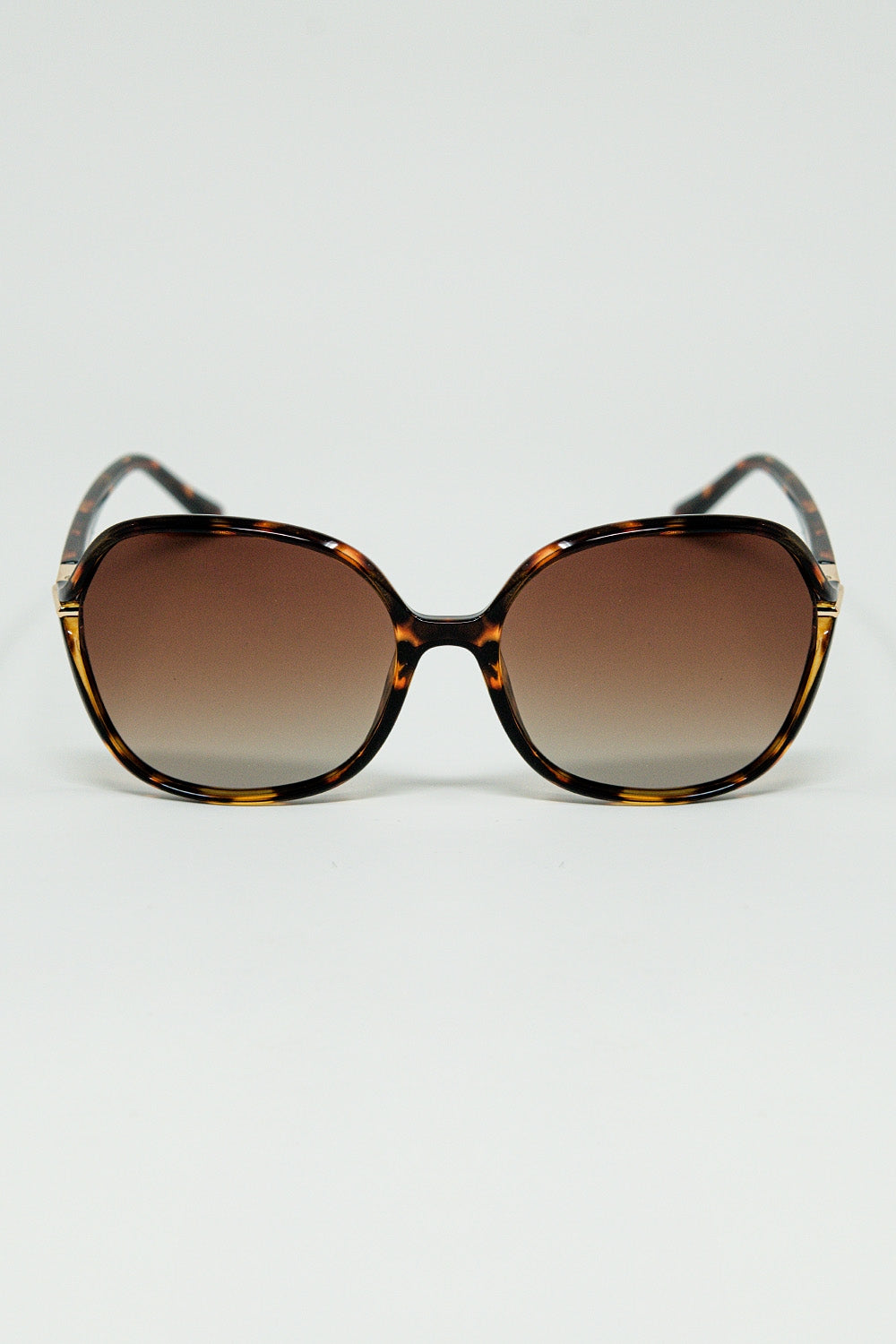 Lunettes de soleil rondes imprimées en beige avec détails en métal doré