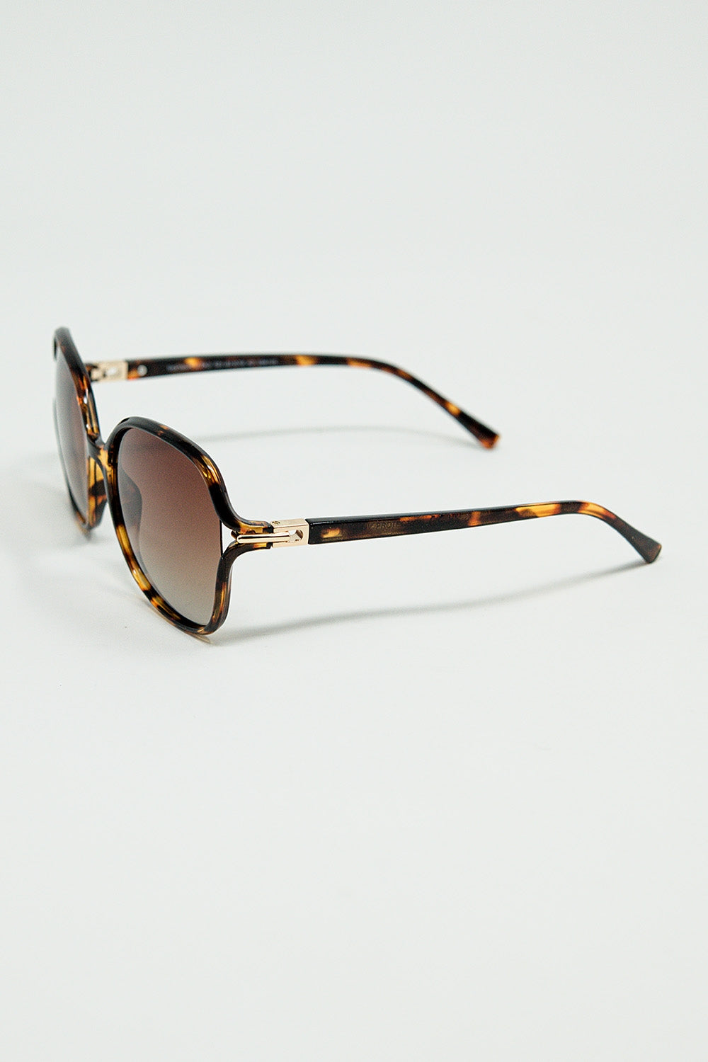 Lunettes de soleil rondes imprimées en beige avec détails en métal doré