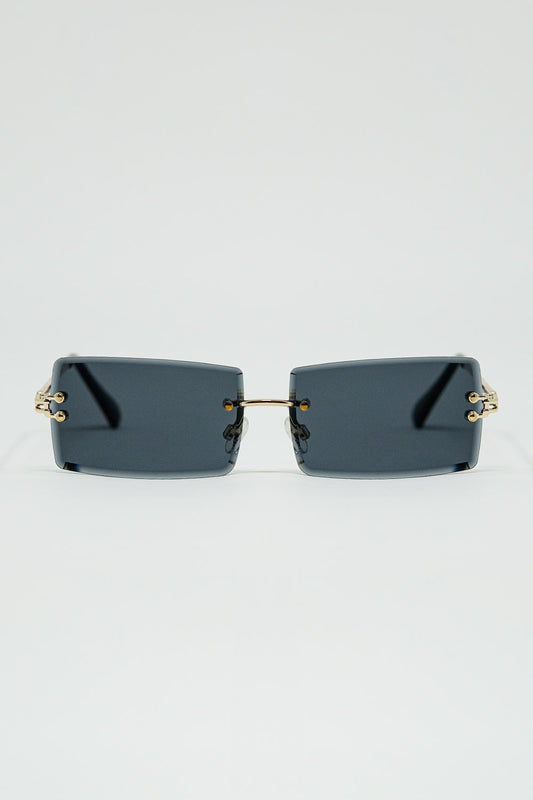 Lunettes de soleil carrées dorées à monture fine avec verres noirs
