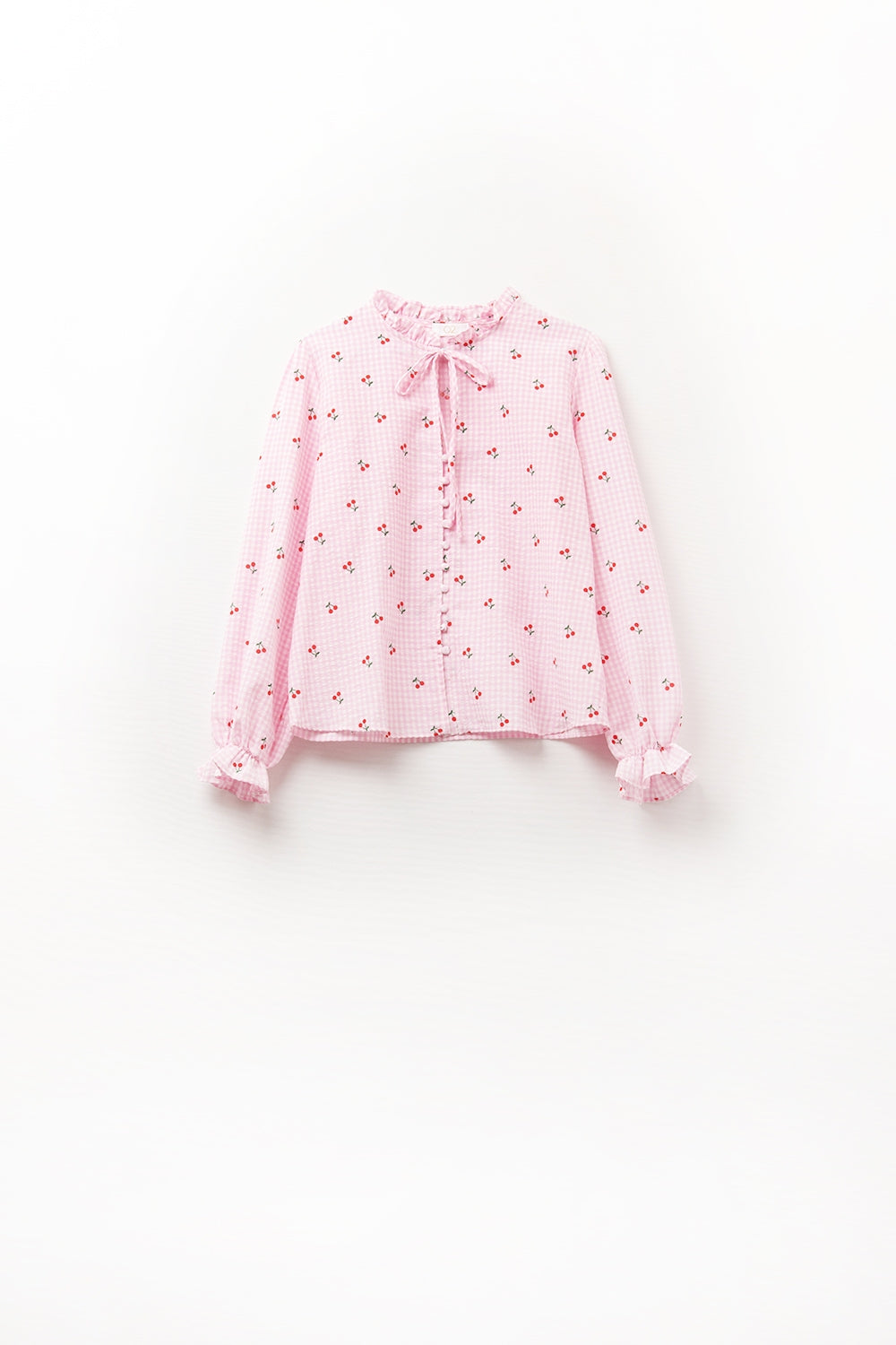 Chemisier rose avec détails de cerises et nœud noué