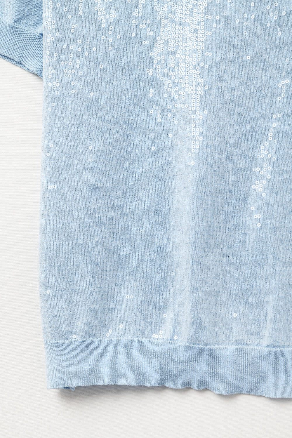 Pull bleu ciel à sequins et col rond