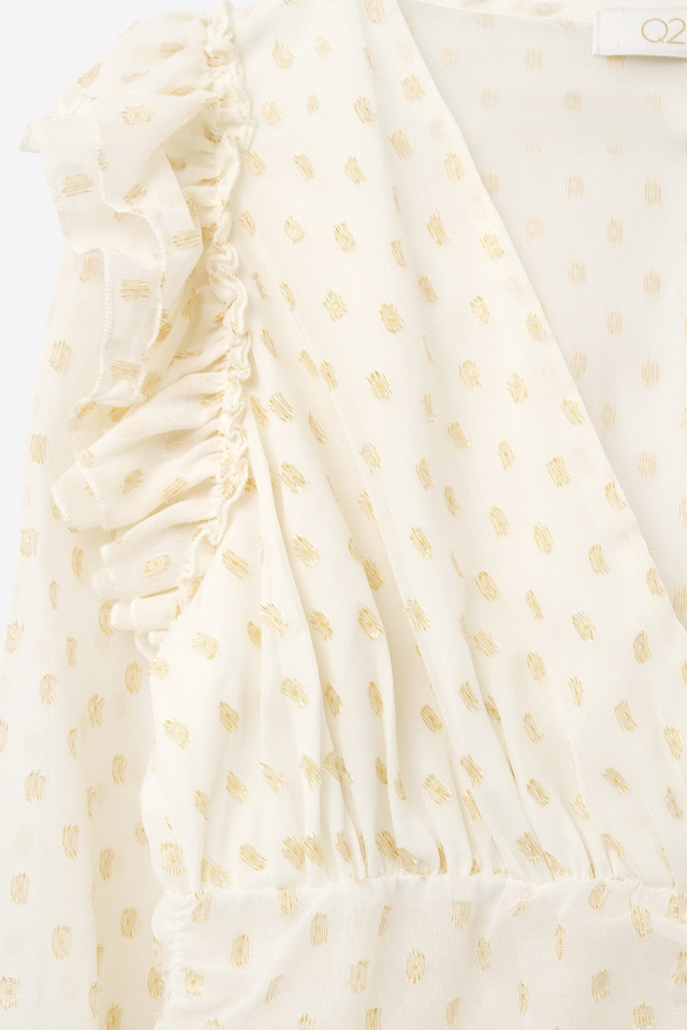 Chemisier beige à pois dorés et à volants