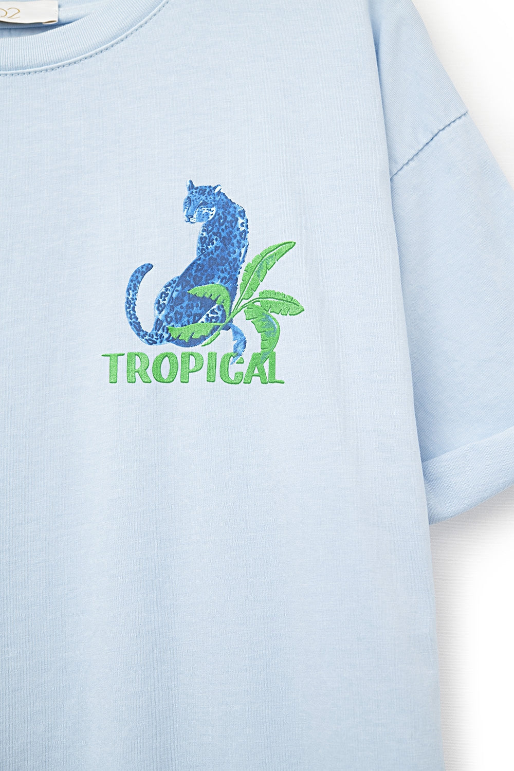 T-shirt bleu fabriqué en Italie avec imprimé graphique tropical