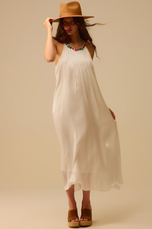 Robe longue dos nu plissée avec encolure en perles
