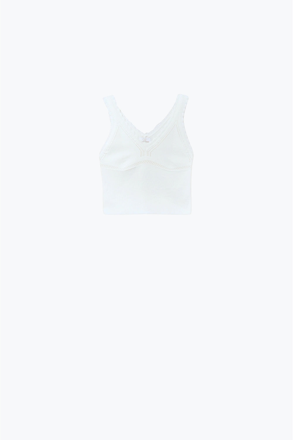Top à col en V en tricot blanc avec bords festonnés