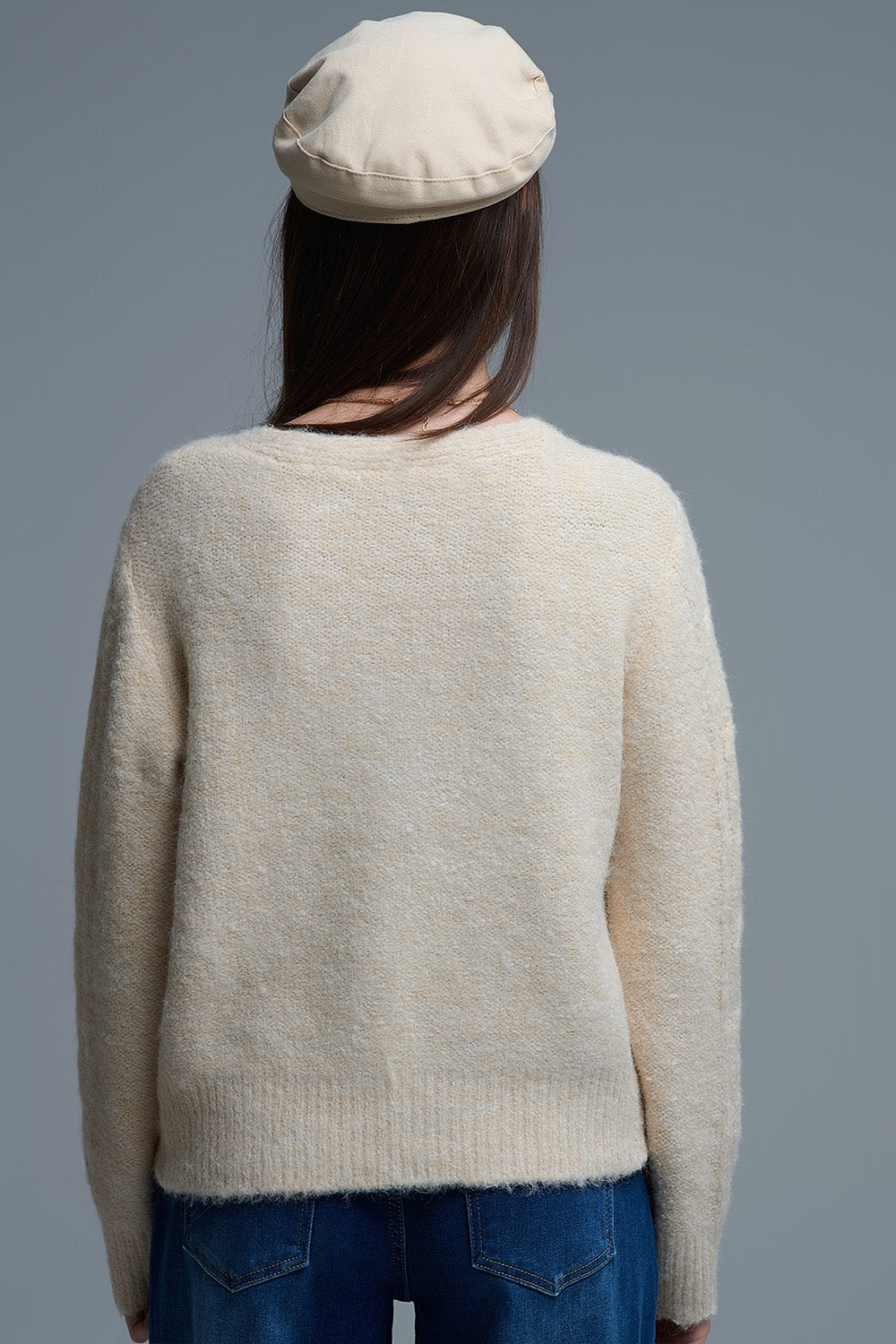 Cardigan beige en maille torsadée avec fleurs brodées