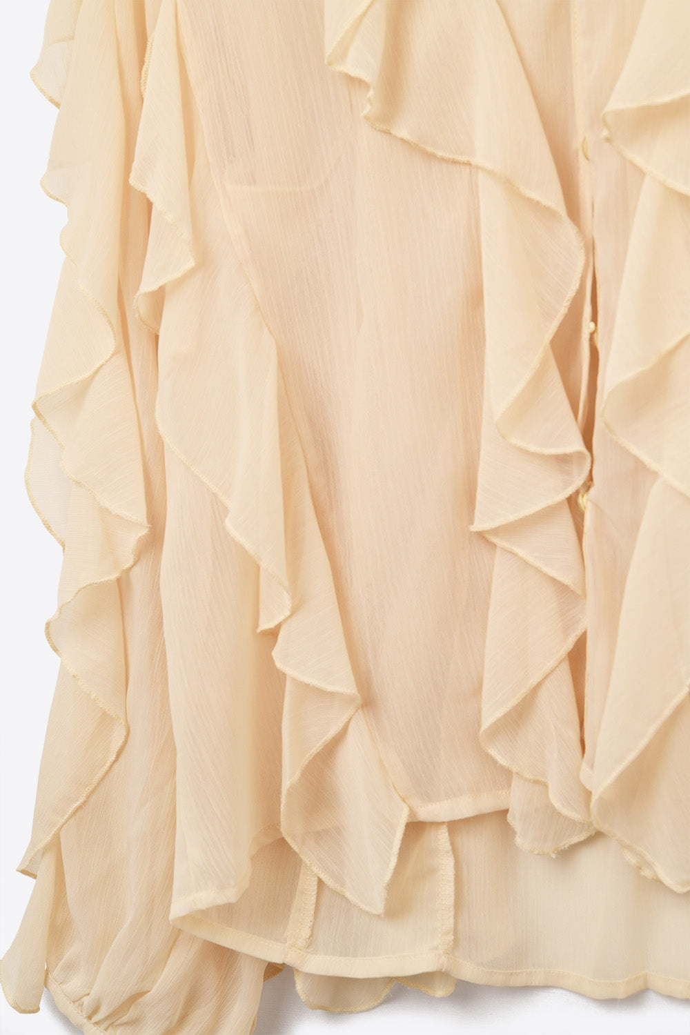 Blouse beige à col V et volants sur l'ensemble du corps