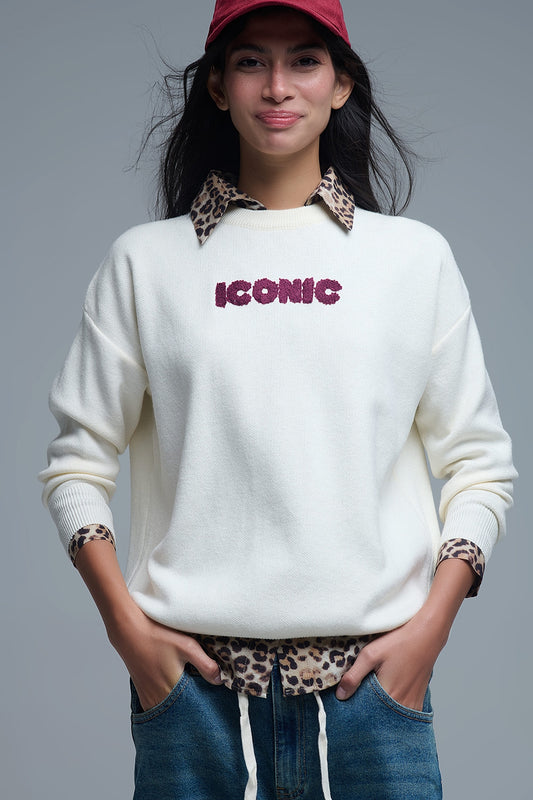 Pull ICONIC brodé avec imprimé Global Tour dans le dos en crème
