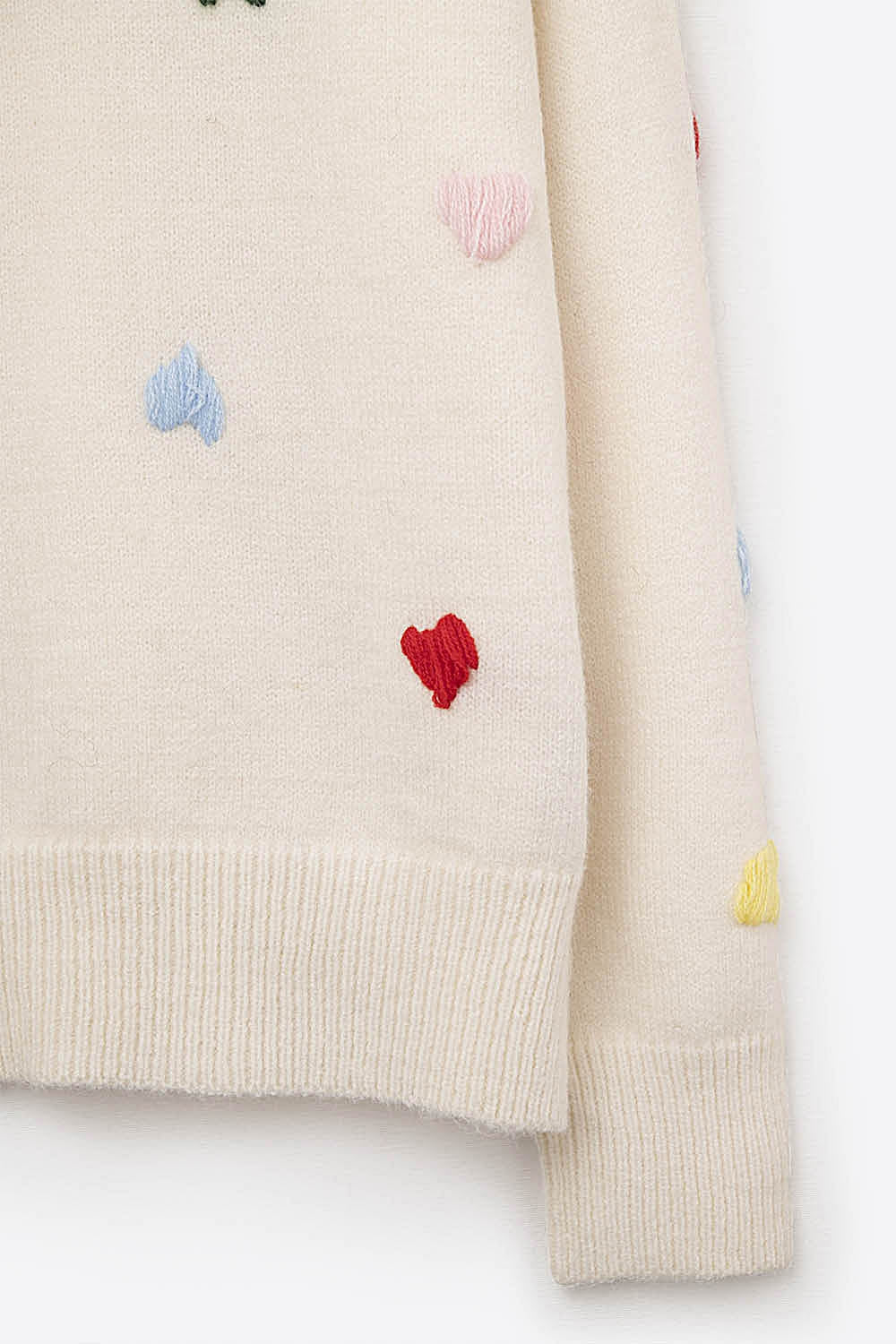 Pull crème avec cœurs brodés multicolores