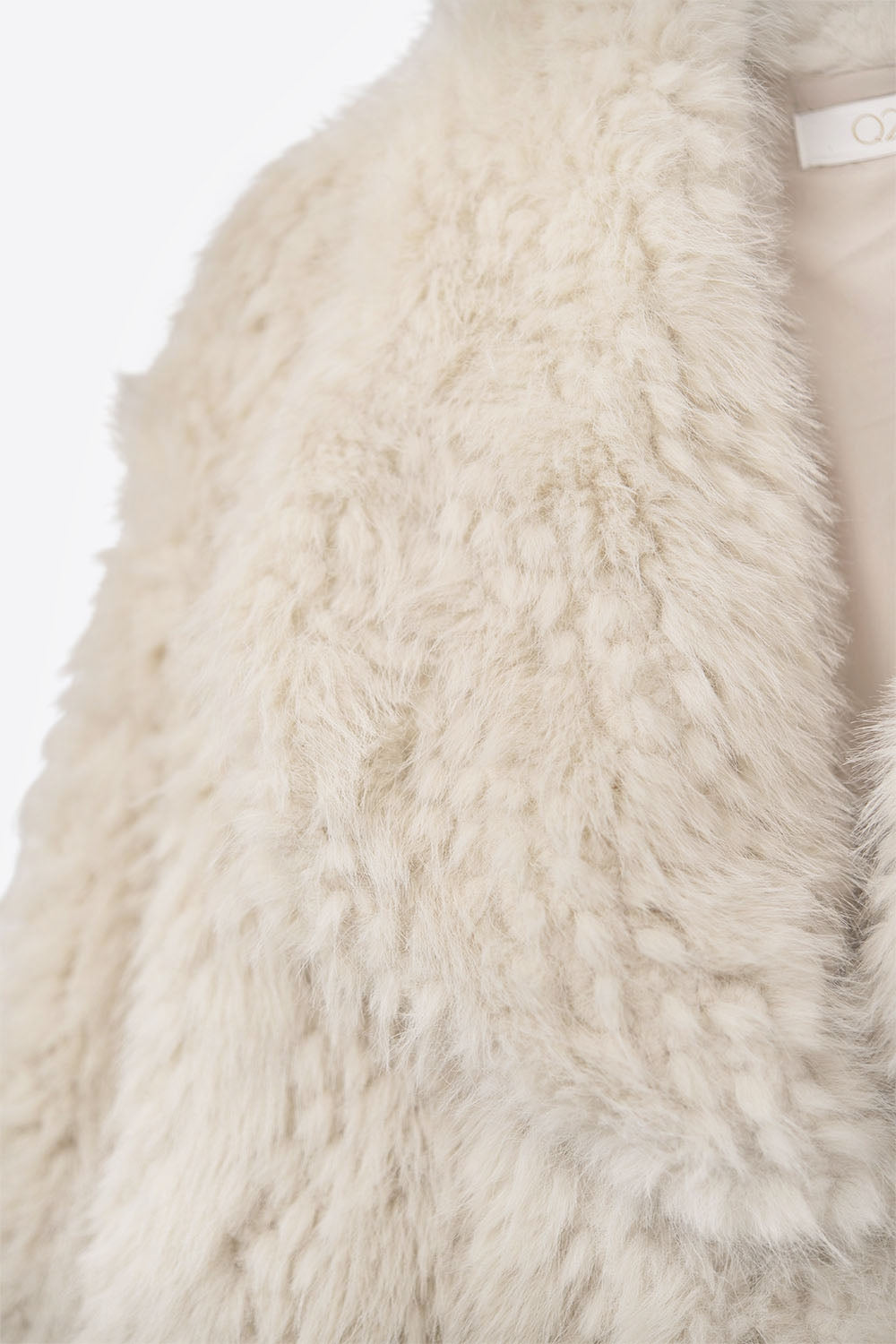 Veste chic en fausse fourrure beige à col large