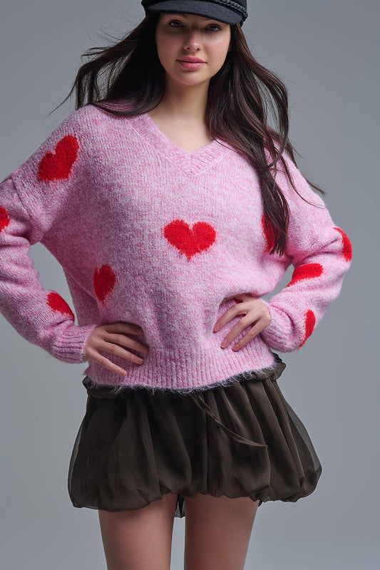 Pull rose à col en V et à manches longues avec cœurs rouges