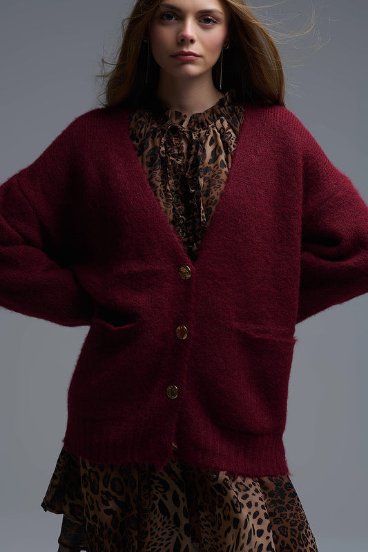 Cardigan surdimensionné en bordeaux avec boutons et poches dorés