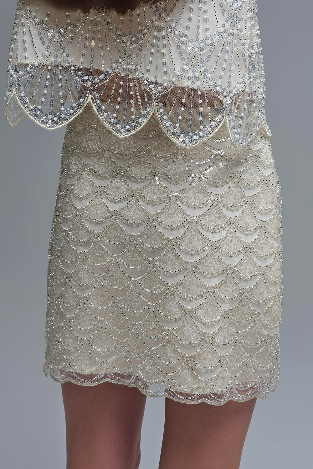 Minijupe à paillettes festonnées crème