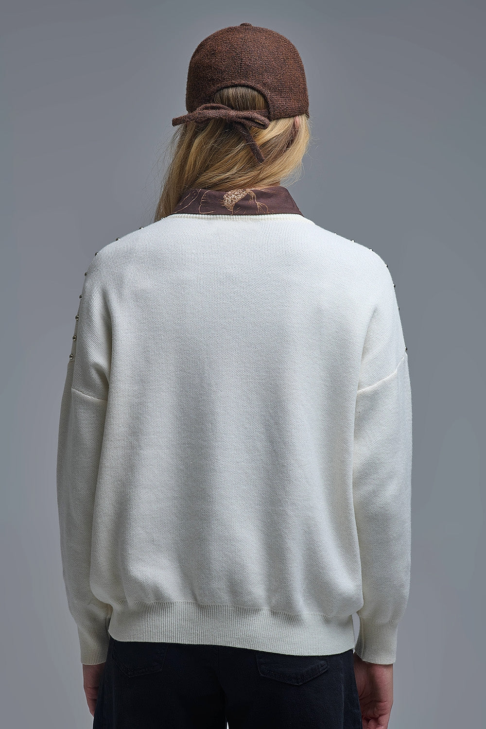 Pull élégant en tricot blanc avec franges