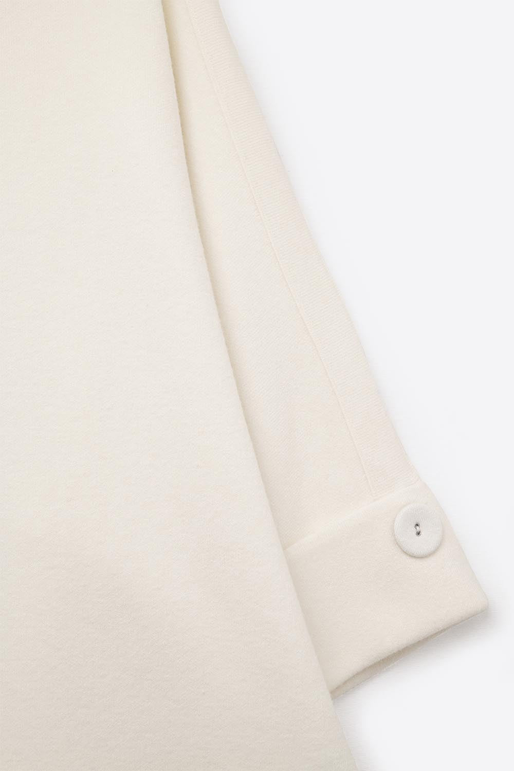 Pull blanc en tricot avec détails de boutons