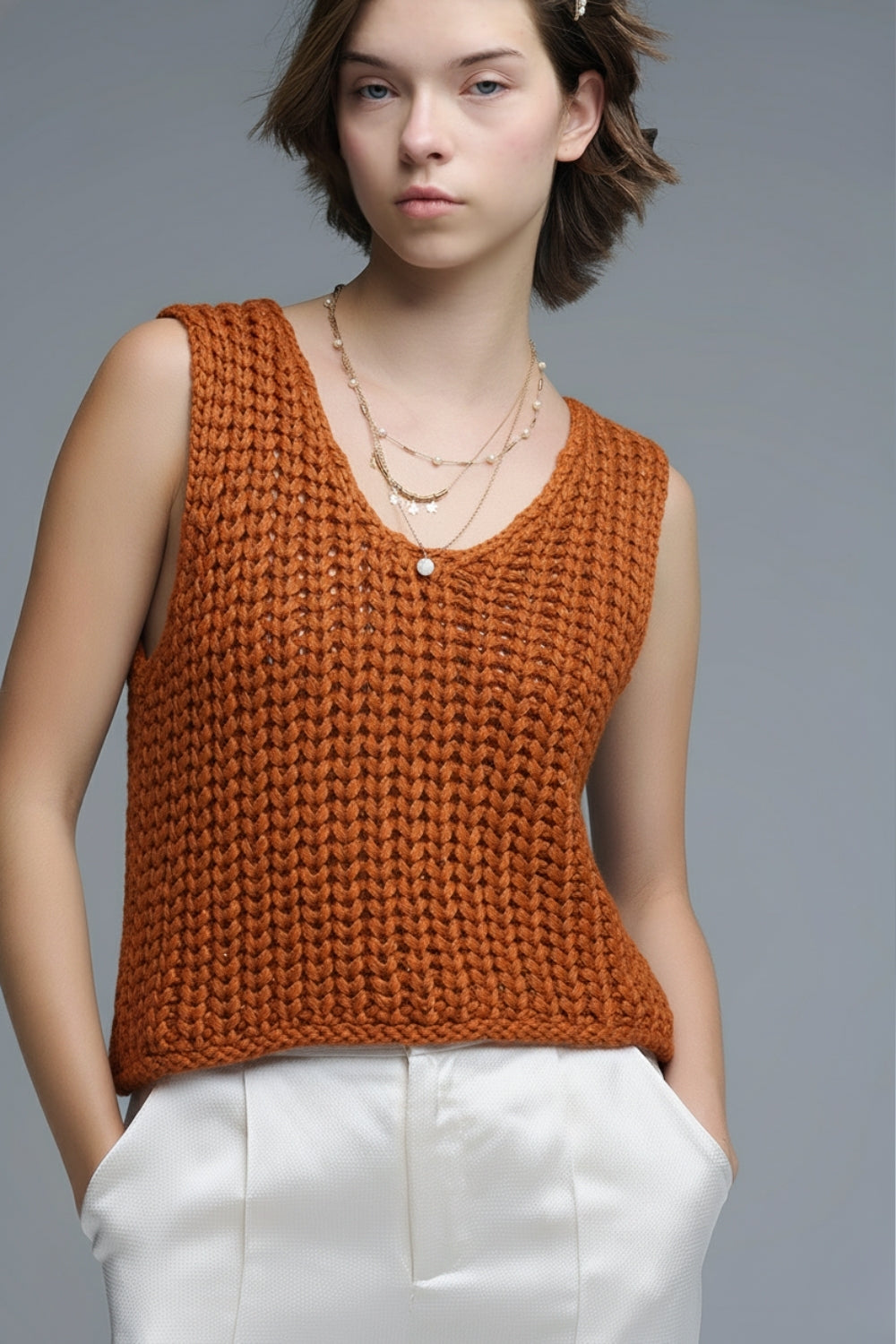 Gilet crocheté orange avec fils pailletés
