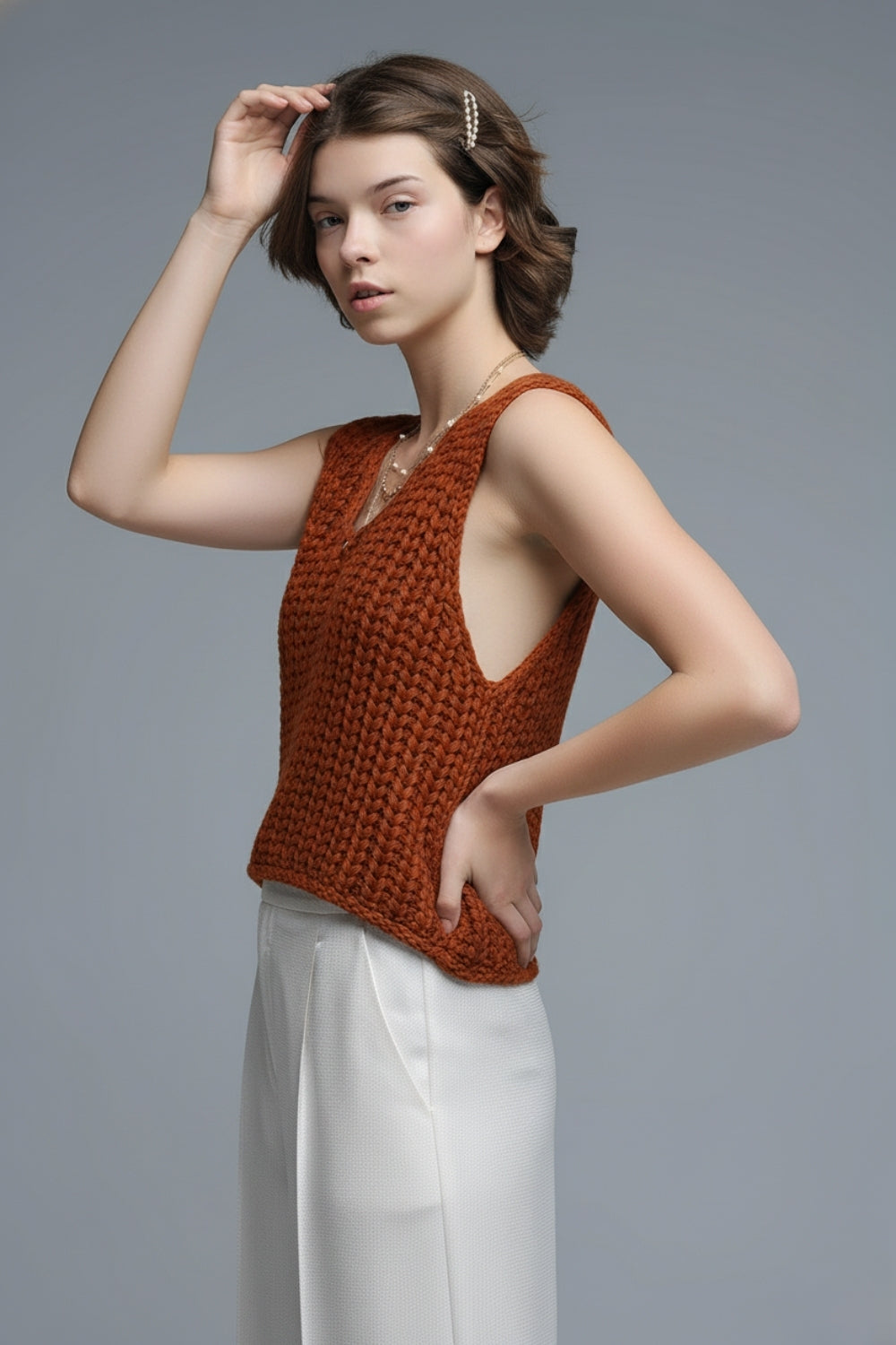 Gilet crocheté orange avec fils pailletés