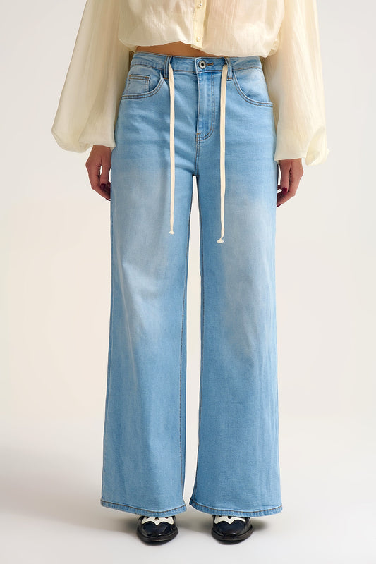Jean à jambe large délavé avec taille ajustable à cordon de serrage