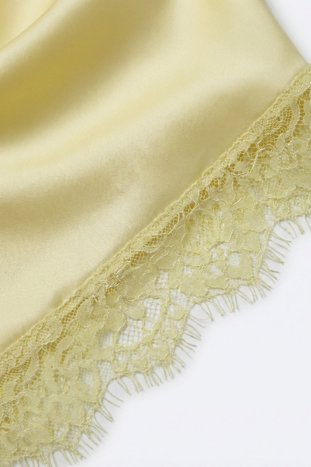 Top sans manches en satin jaune avec bordure en dentelle
