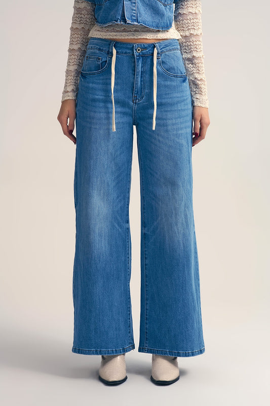 Jean à jambe large en délavage léger avec taille à cordon de serrage