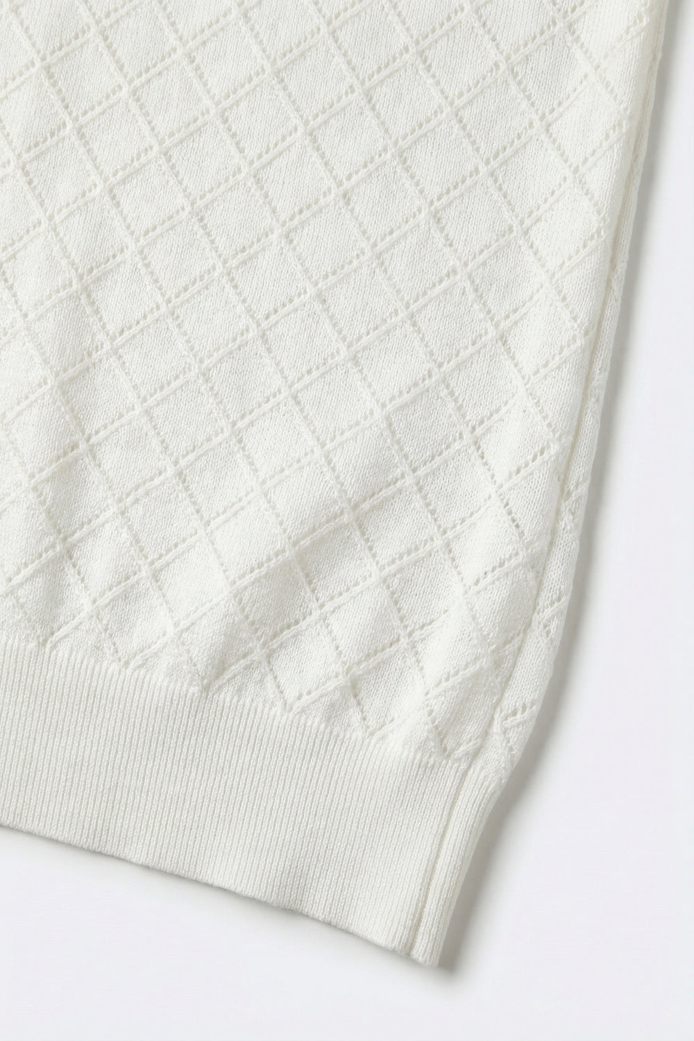 Pull en tricot texturé blanc à motif de diamants