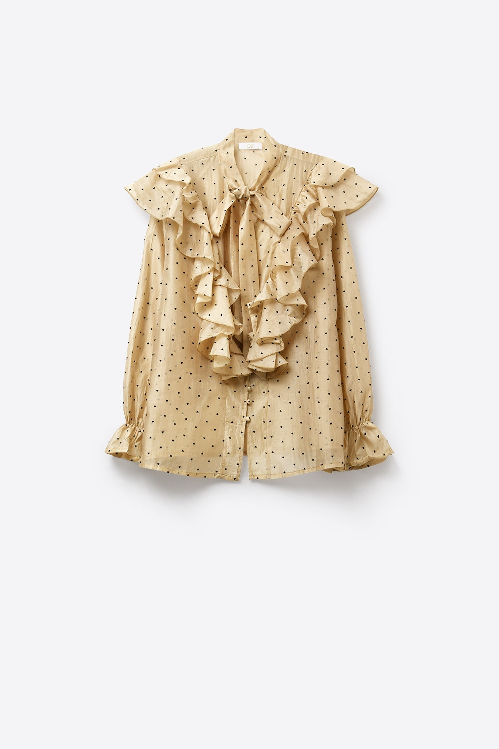 Blouse beige à pois à volants avec col à nouer