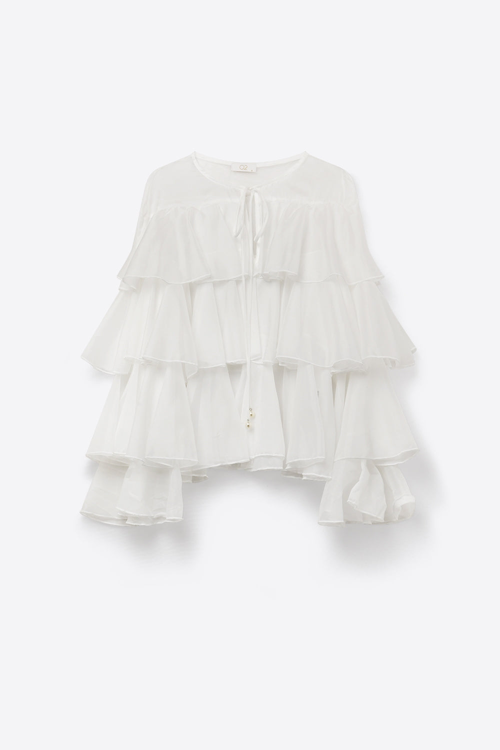 Blouse blanche à volants superposés avec col à nouer