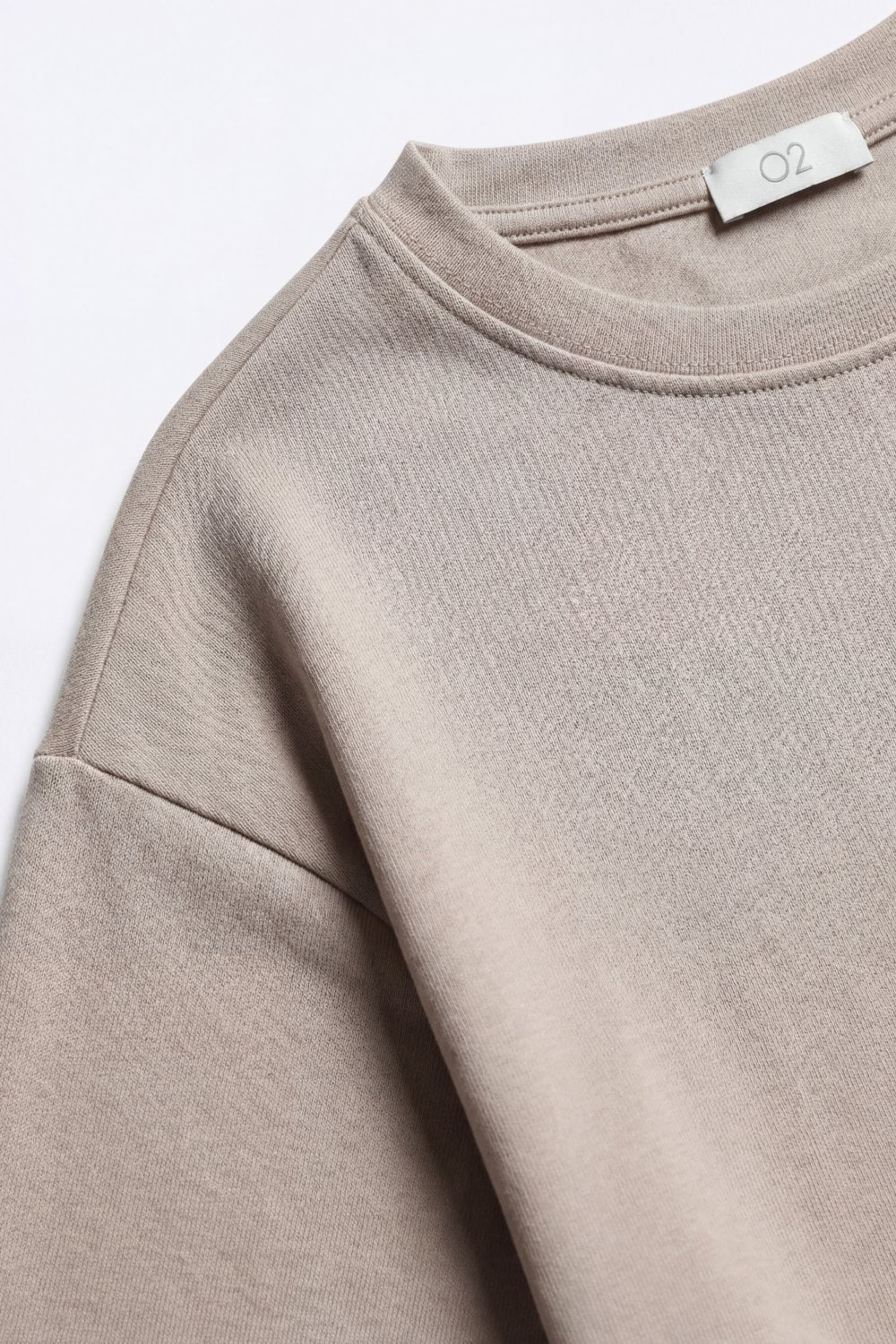 Sweat-shirt à manches courtes et col rond en coupe décontractée couleur beige