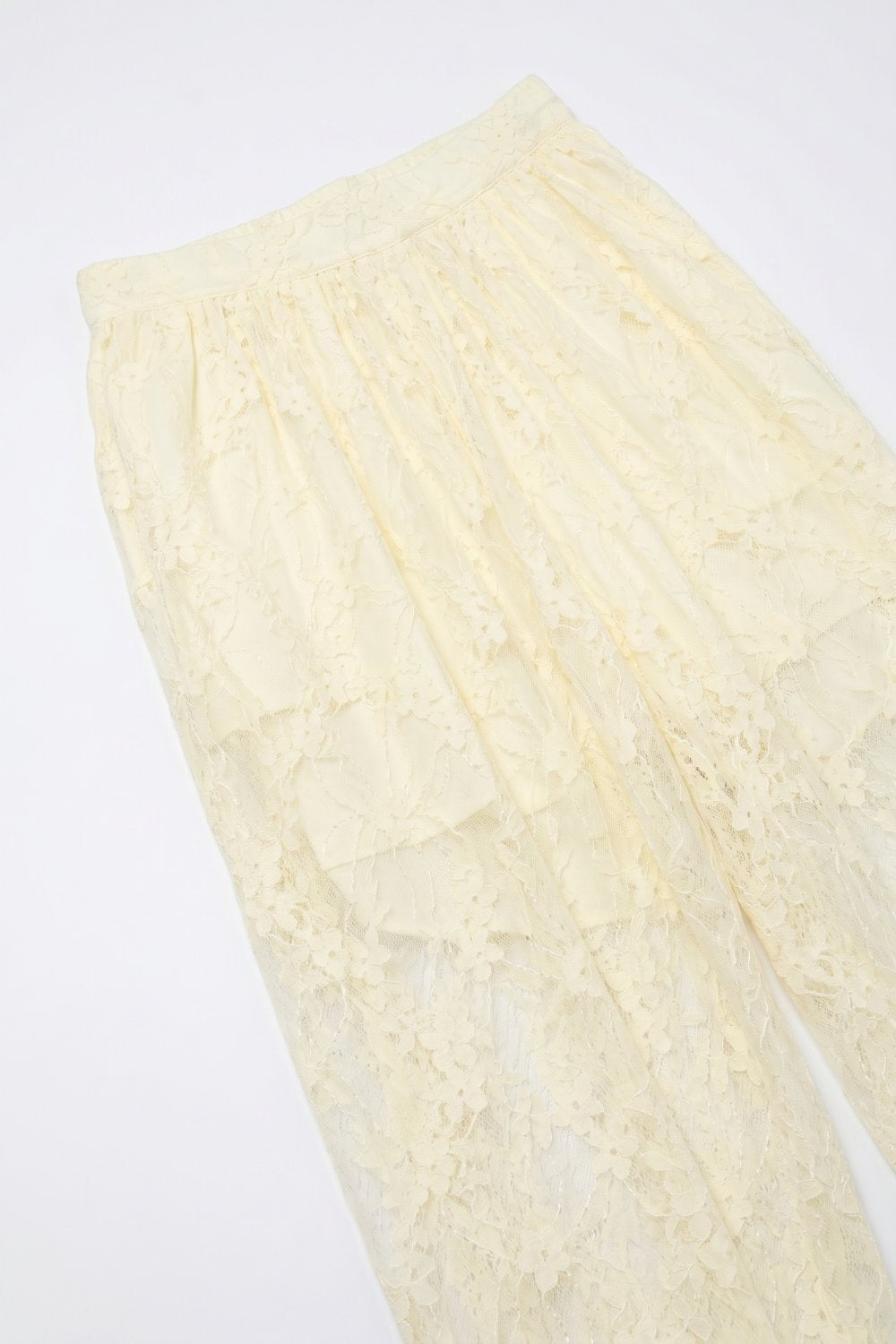 Pantalon de coupe décontractée en dentelle florale crème à ourlet transparent