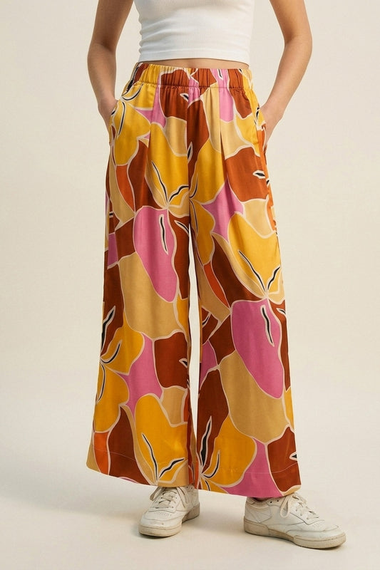 Pantalon large à imprimé tropical dans des tons orange chaud