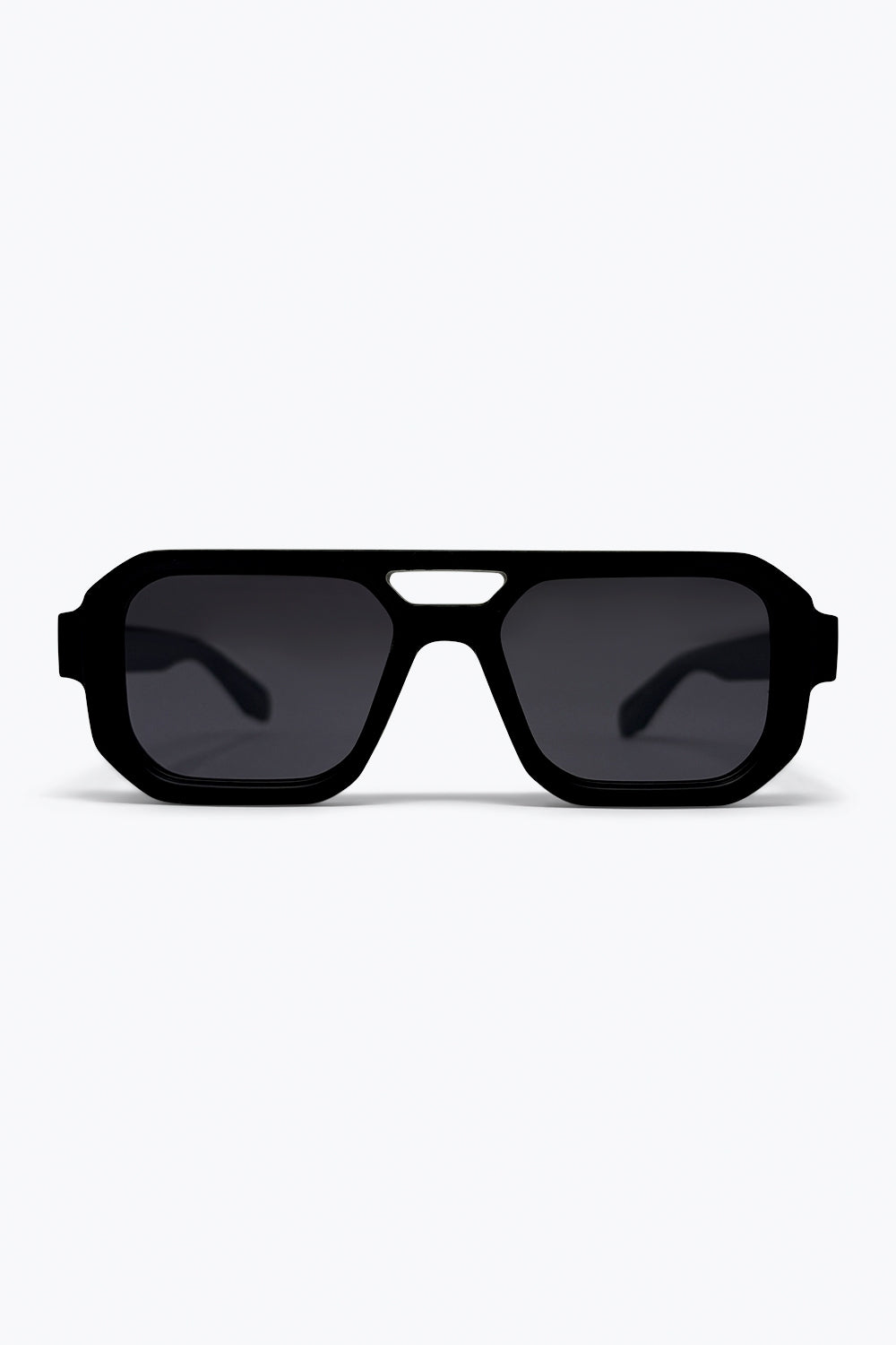Lunettes de soleil urbaines noires oversize à monture géométrique et branches épaisses