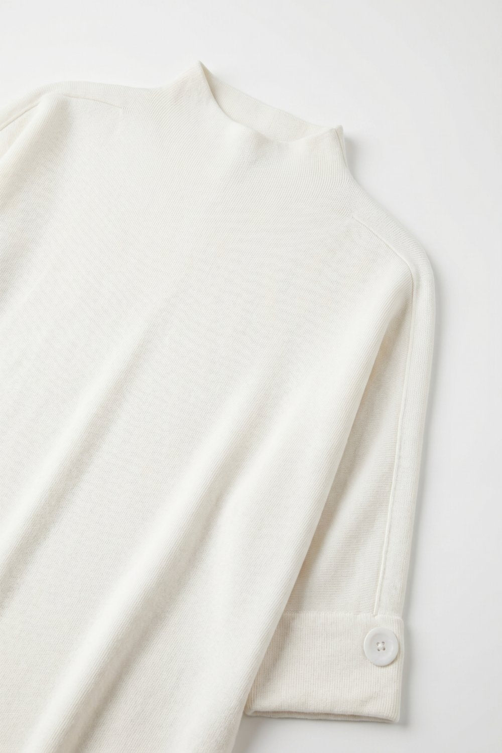 Pull blanc en tricot avec détails de boutons