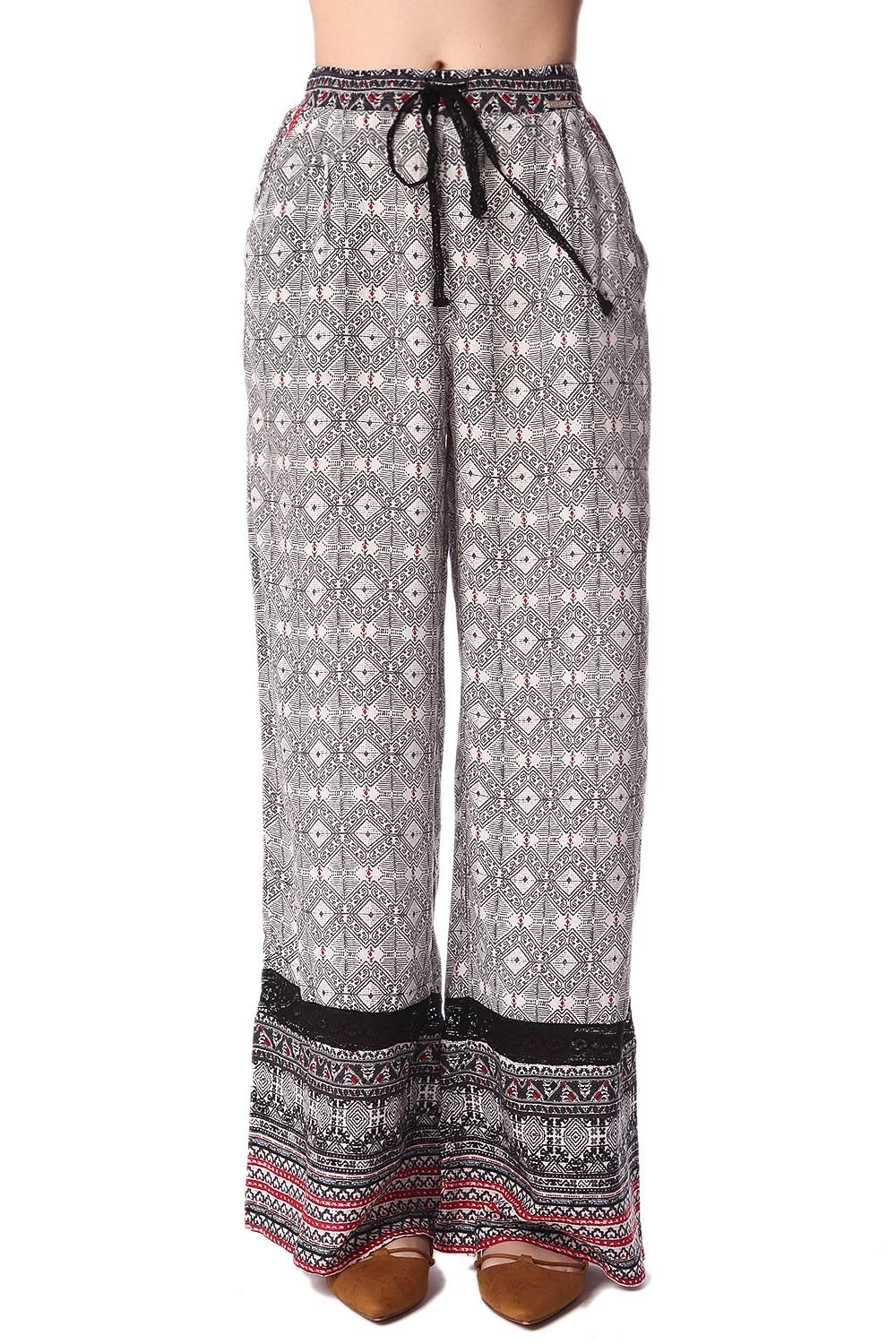 Pantalon large noir à imprimé ethnique et insert en dentelle frangée