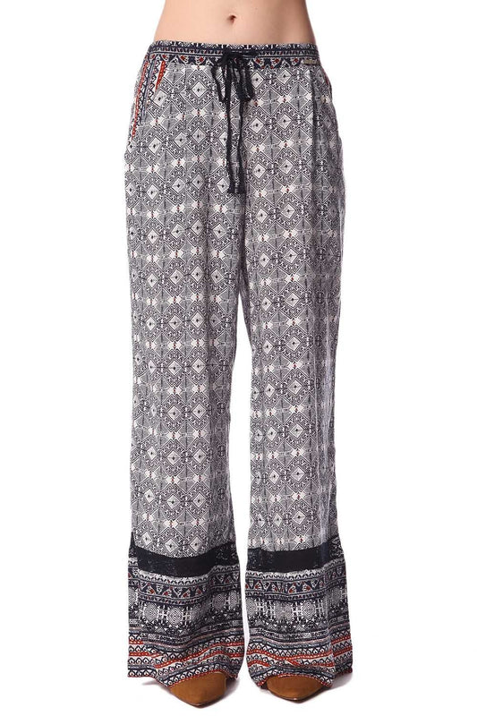 Pantalon large bleu à imprimé ethnique et insert en dentelle frangée