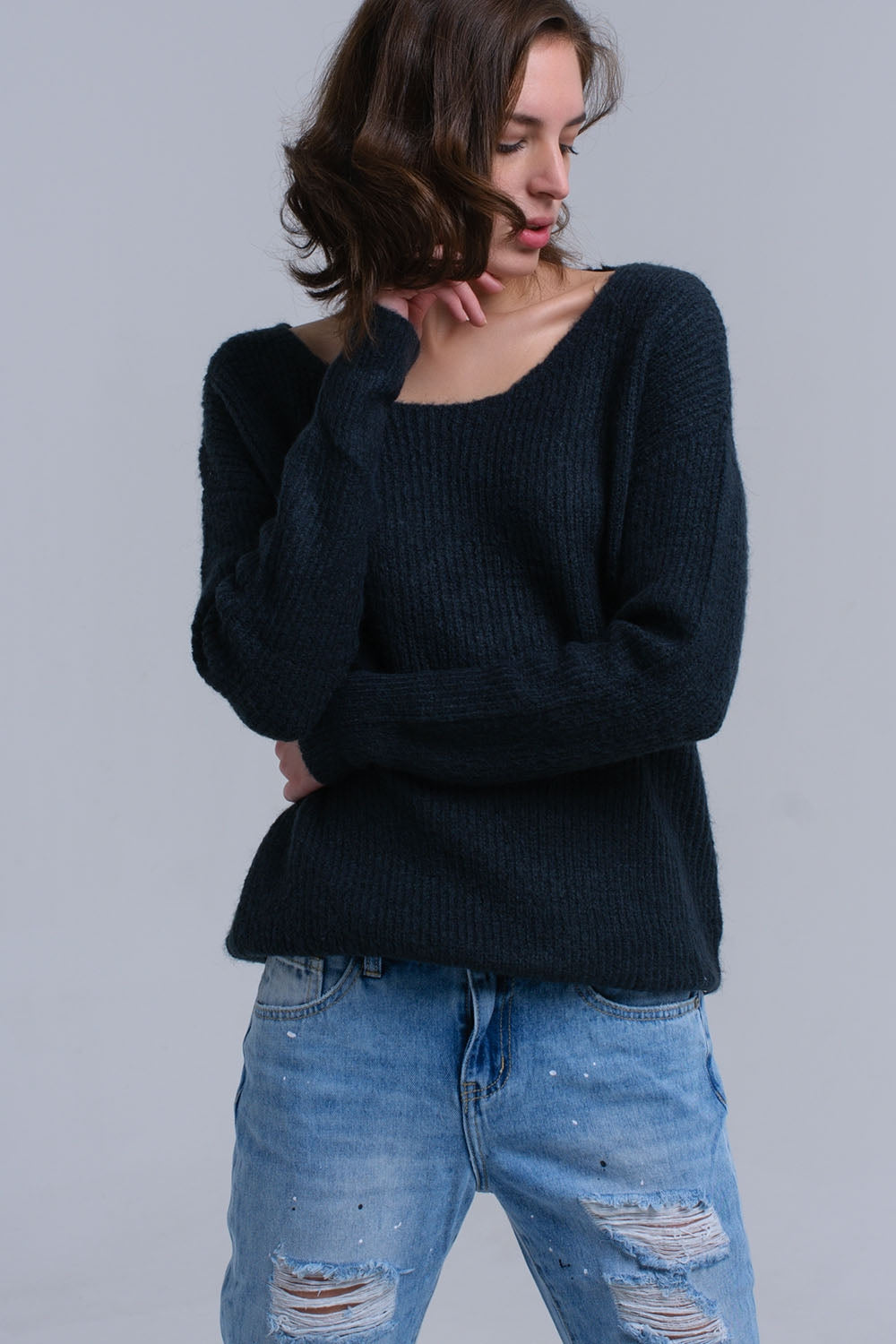 Pull en maille vert avec fermeture à nouer