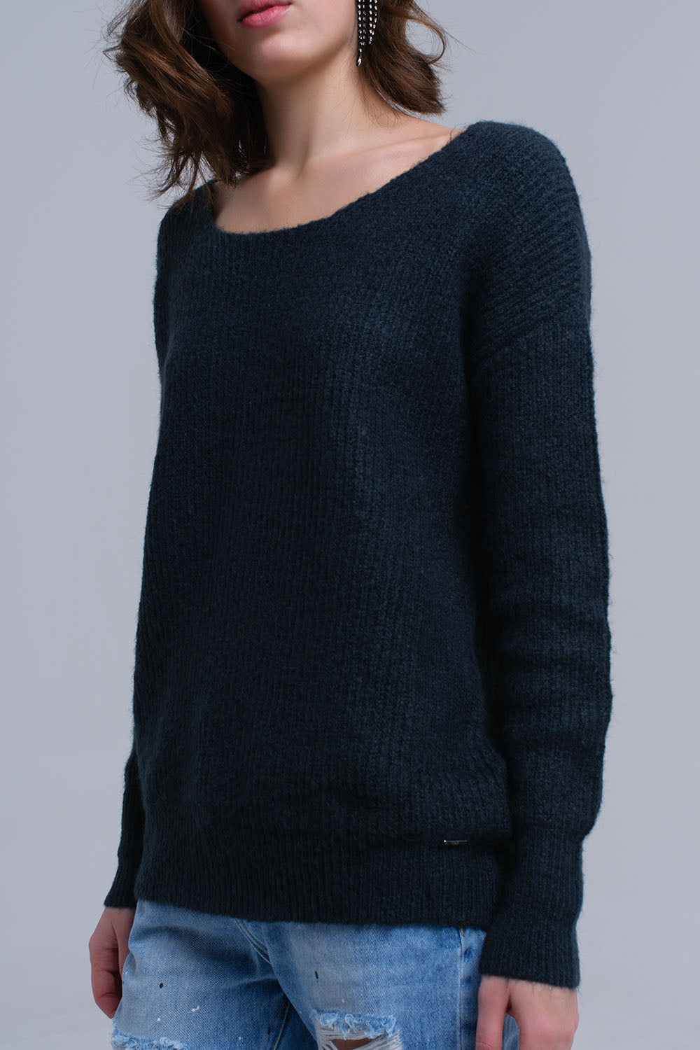 Pull en maille vert avec fermeture à nouer