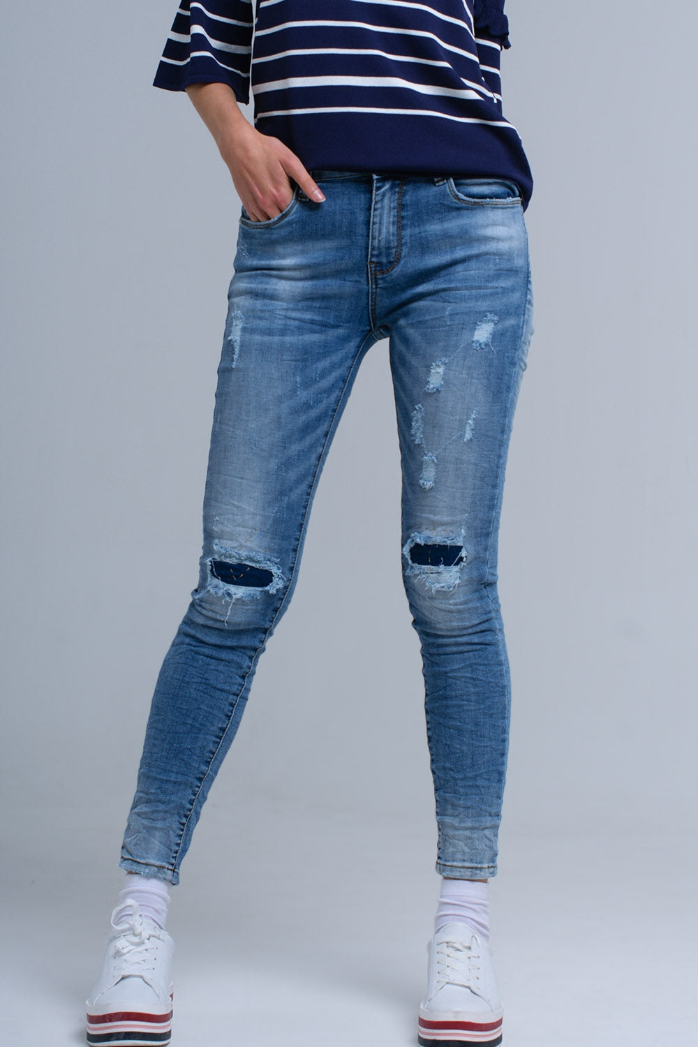 Jeans skinny avec déchirures