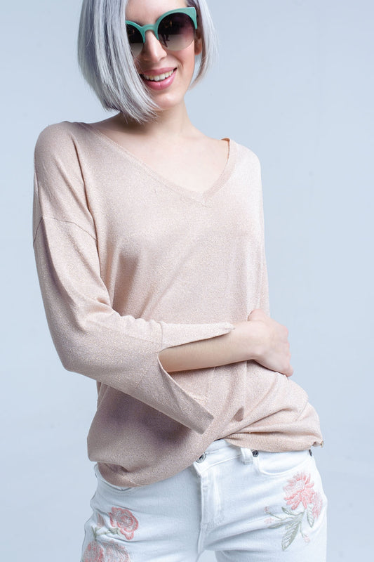 Pull en maille rose avec détail en lurex doré