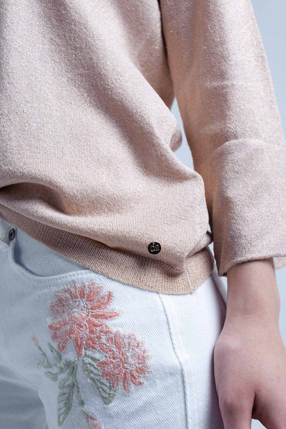 Pull en maille rose avec détail en lurex doré