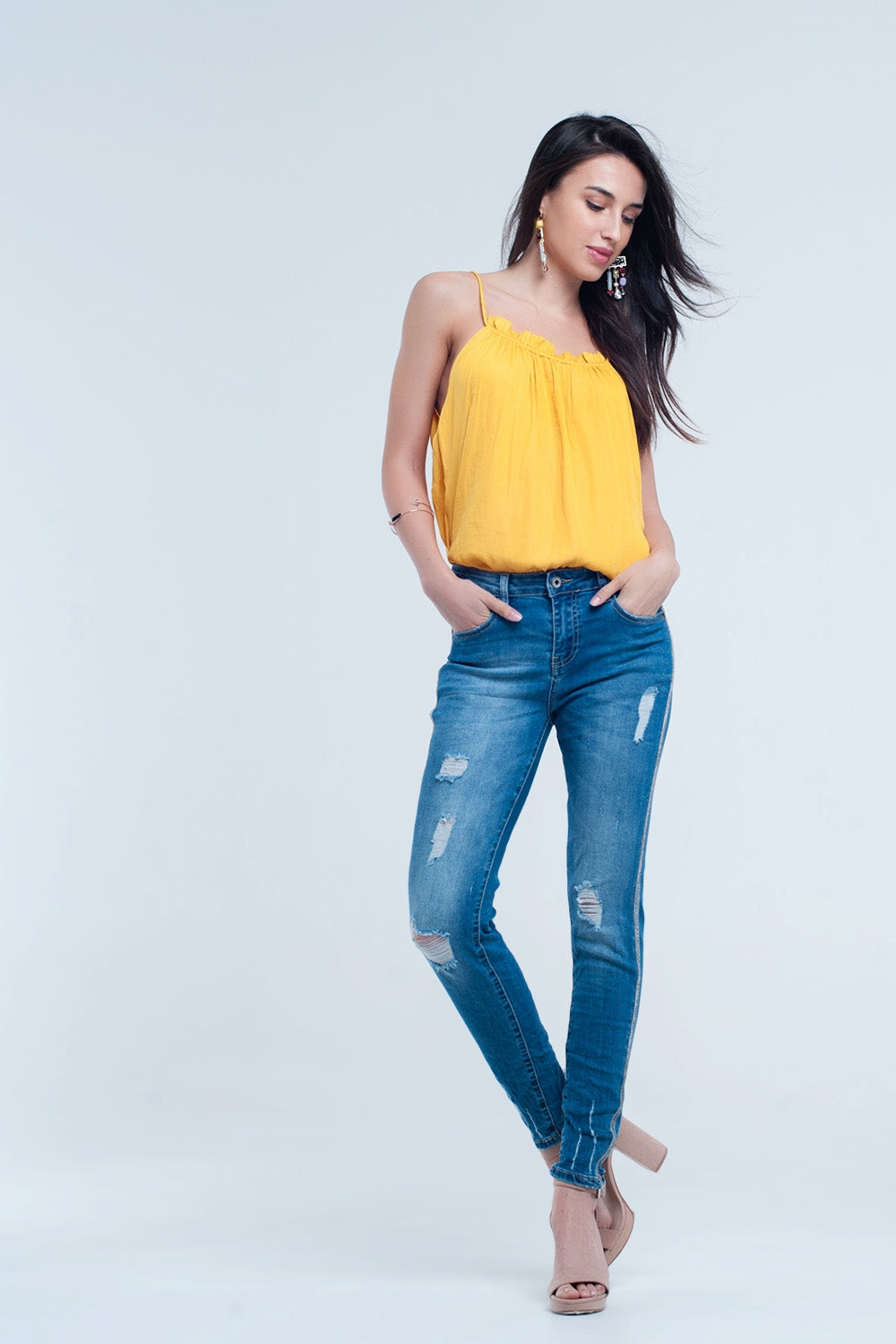 Jean skinny avec déchirures et paillettes