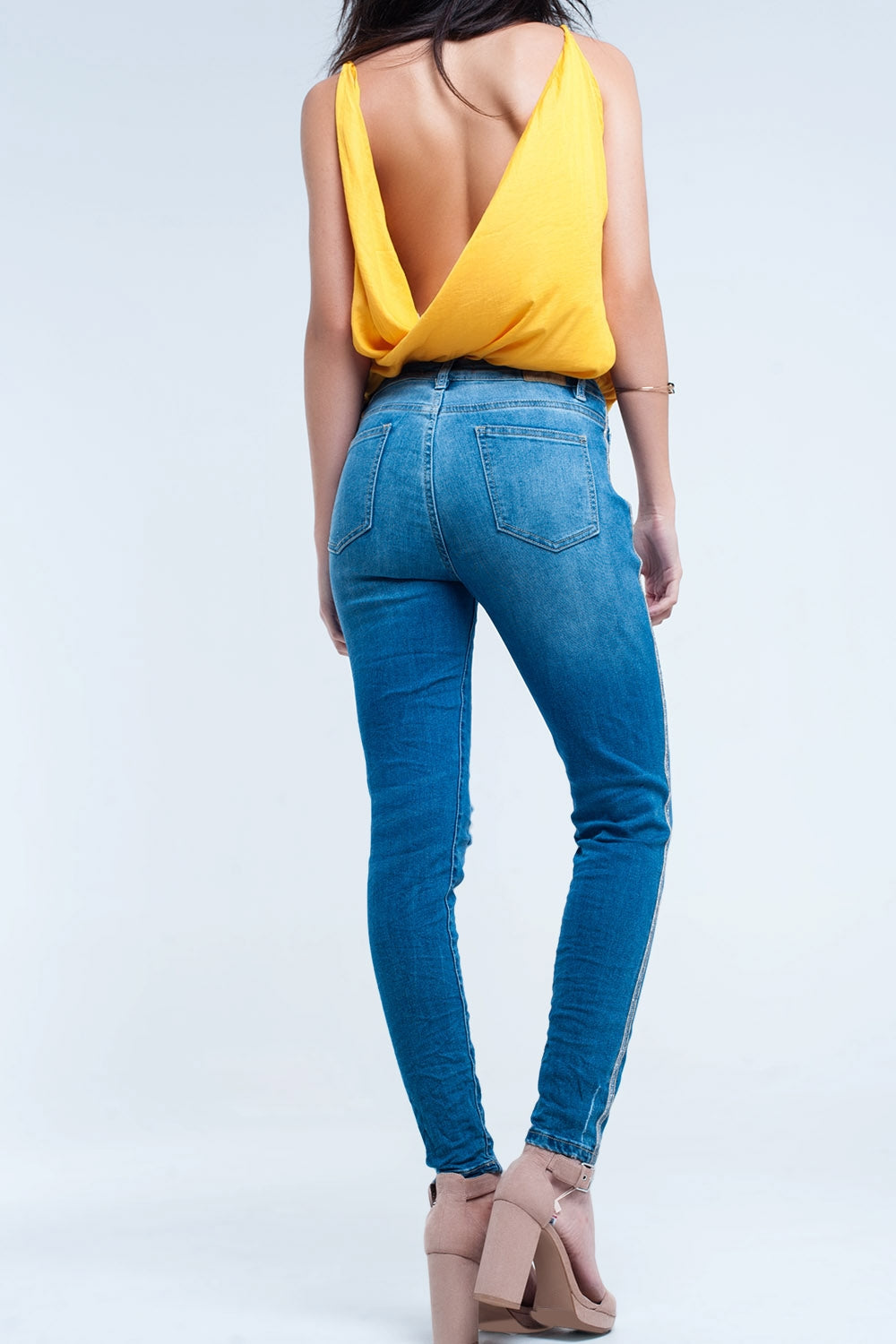 Jean skinny avec déchirures et paillettes