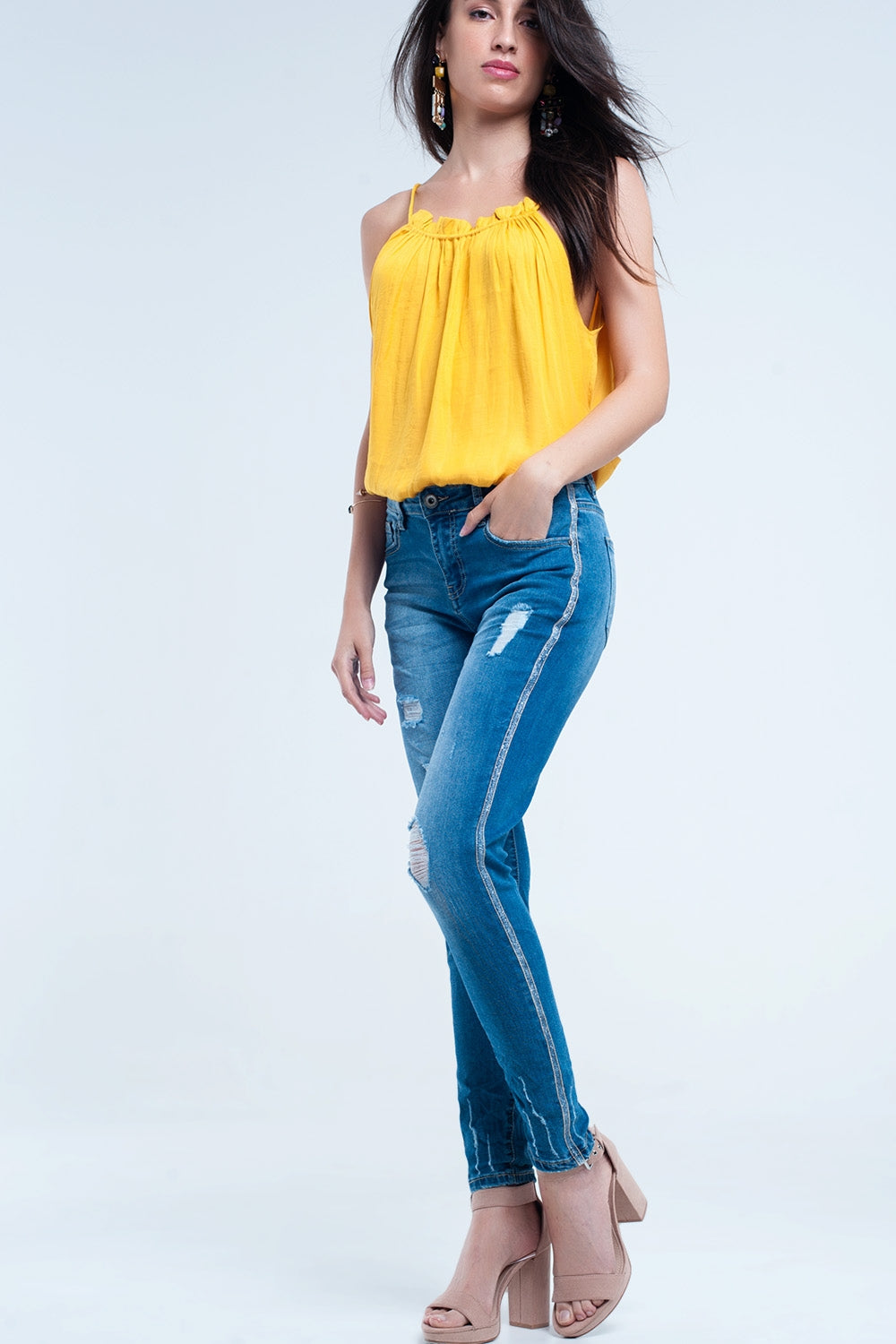 Jean skinny avec déchirures et paillettes