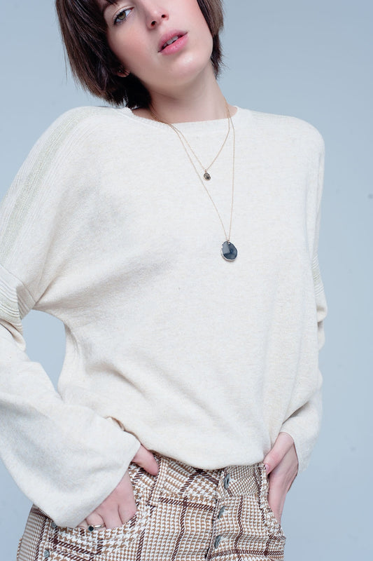 Pull fin tricoté beige avec détails du scintillement