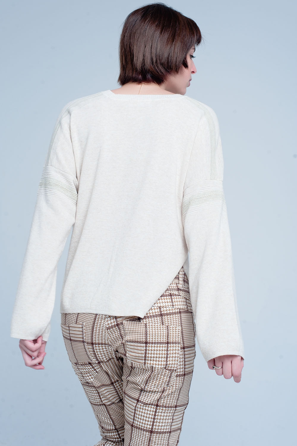 Pull fin tricoté beige avec détails du scintillement